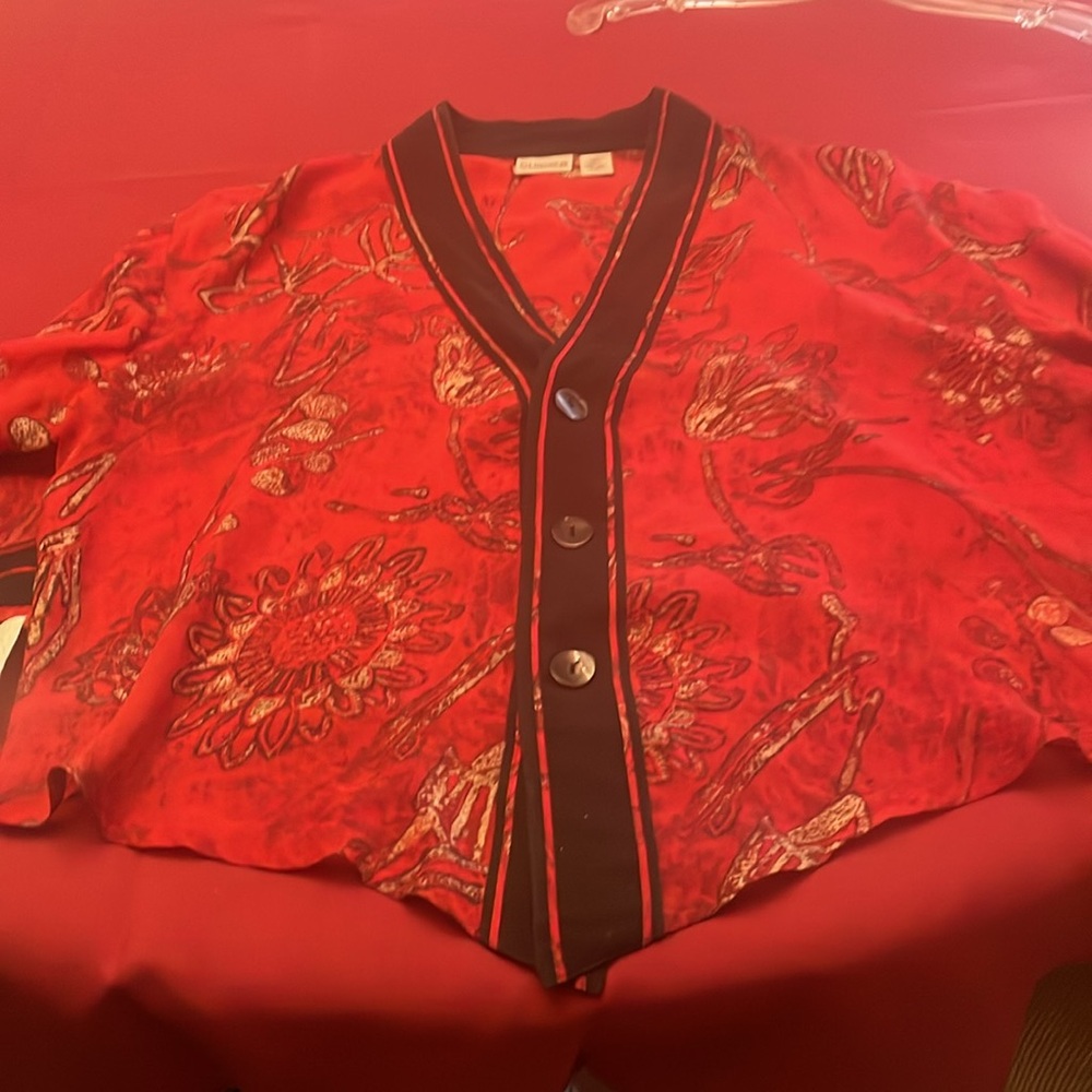 Chico’s 100% Silk sheer topper Red with
Black trim and black& red pattern